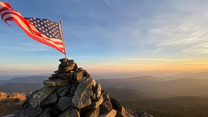 Flag on top of mountain