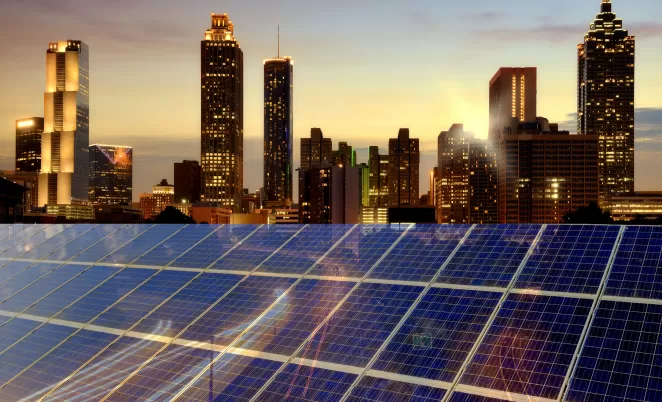 solar panels in front of nighttime cityscape